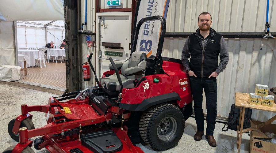 Toro and Hayter’s territory manager Ben Kirkby next to a zero turn mower 