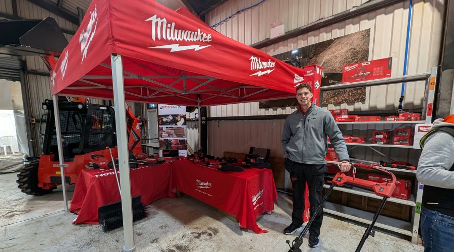 Milwaukee area sales manager Calum Weaver in front of red Milwaukee stand