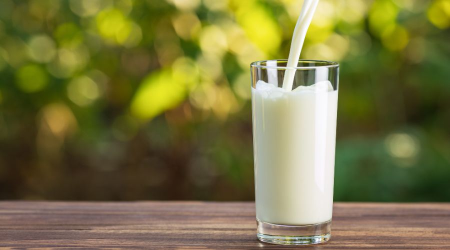 milk being poured into glass