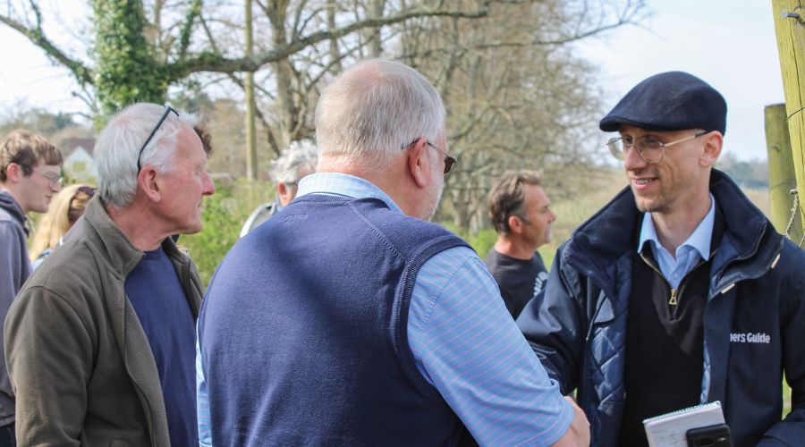 Farmers Guide podcast co presenter Daniel Hodge meeting farmers